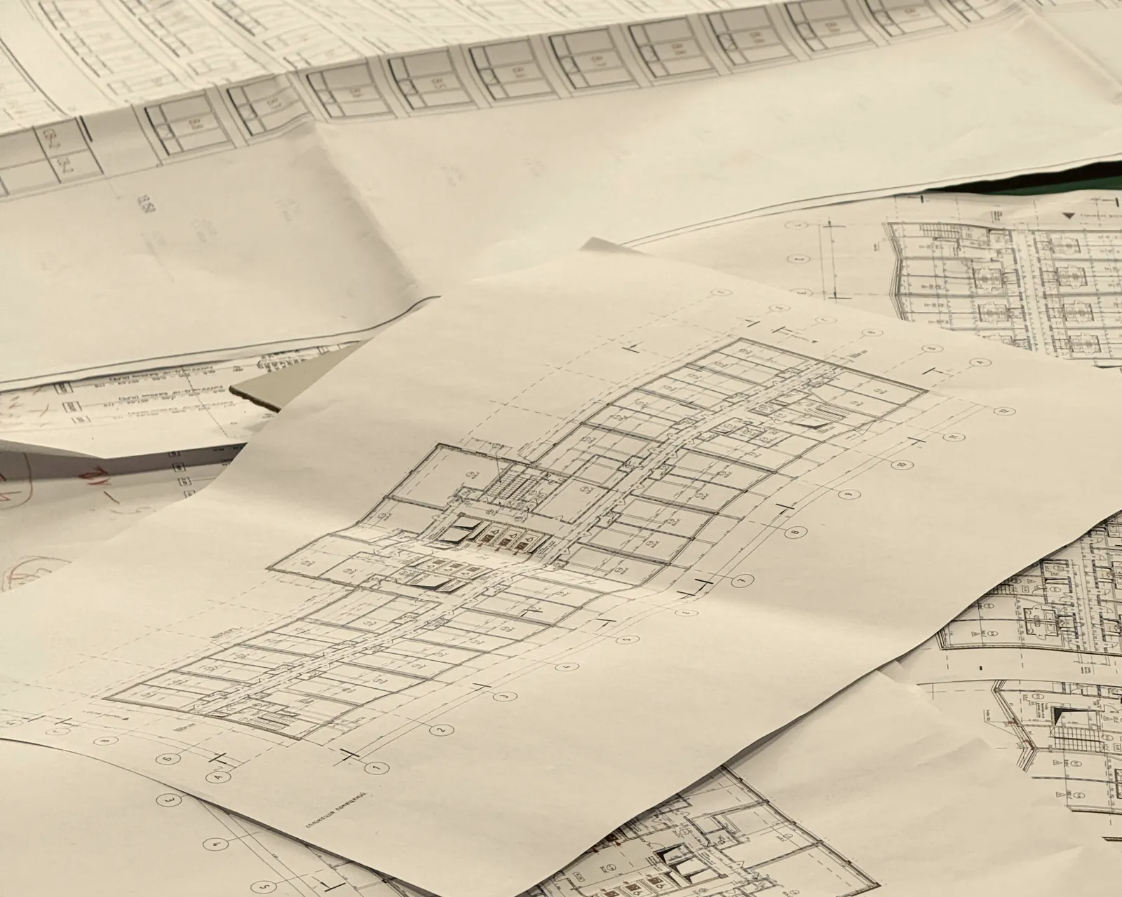 Architectural drawings for a development, laid out on a table